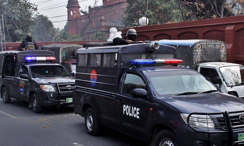 Pakistani police vehicles on patrol with armed officers, ensuring security in the area. (Photo Credit: DAILY PAKISTAN)