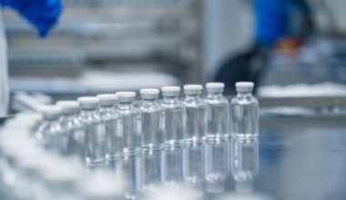 Bottles on a conveyor belt at a pharmaceutical bottle manufacturing plant
