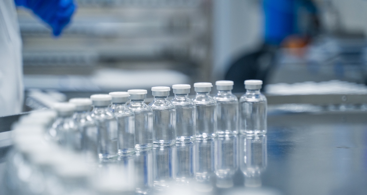 Bottles on a conveyor belt at a pharmaceutical bottle manufacturing plant