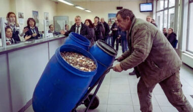 Bulgaria: Ridiculous Scenes as a Citizen Brings Canisters Filled with Coins to a Bank in Bulgaria