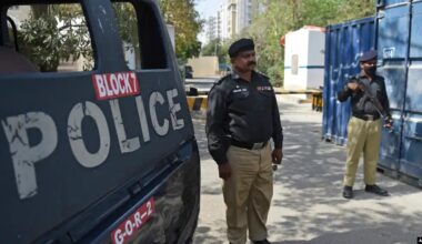 Pakistani police officers stand guard during security operations that have heightened fear among asylum-seeking families and children living in Pakistan. (Photo Credit: AFP)