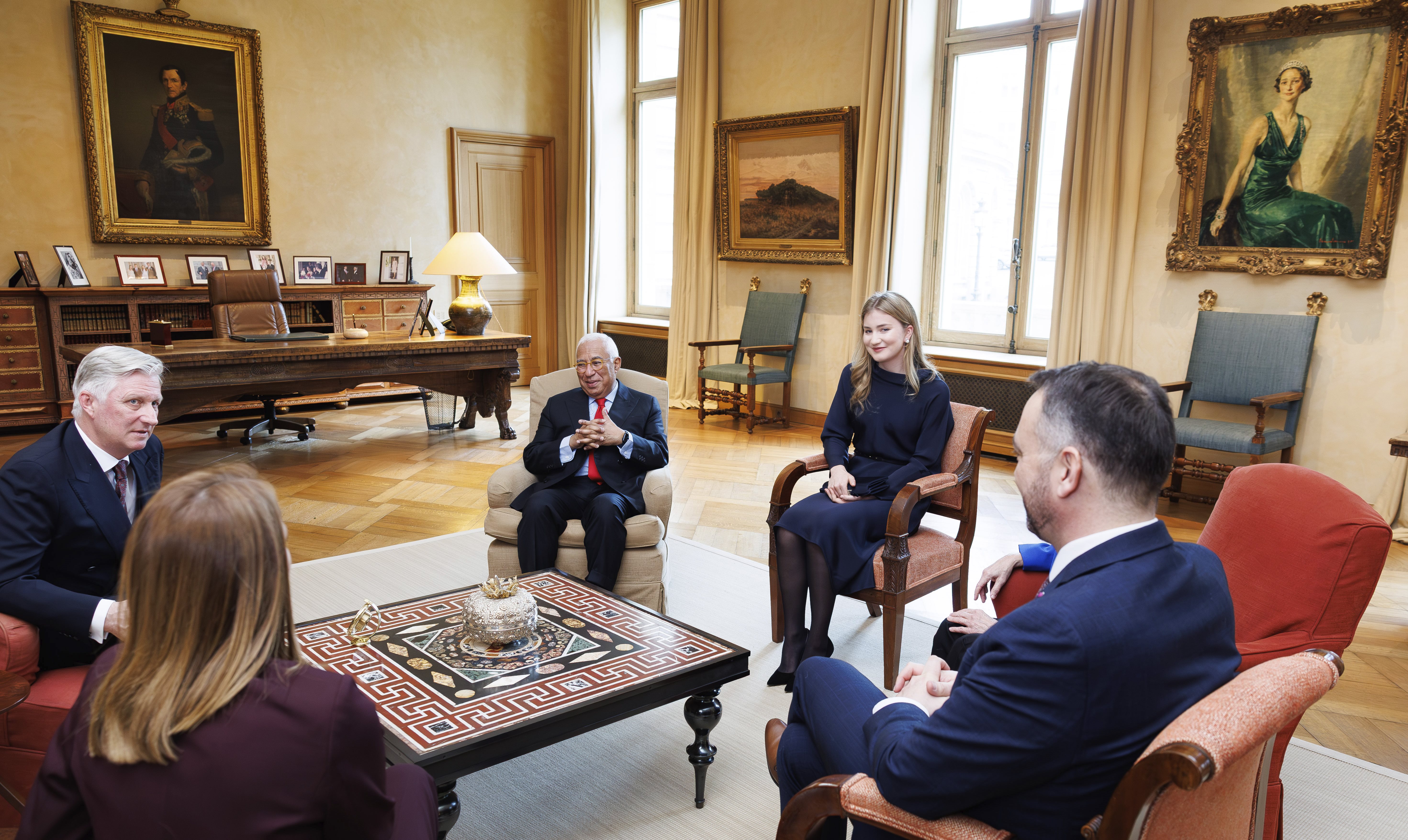 Princess Elisabeth and King Philippe with world leaders sitting in chairs at the royal palace