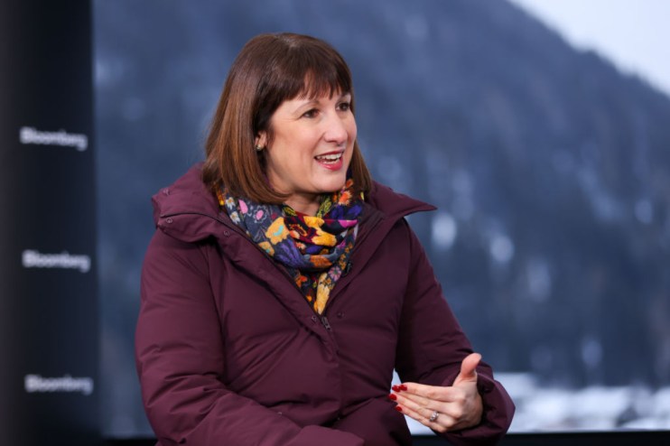 Rachel Reeves speaking at Davos WEF, discussing Labours economic policies amidst global leaders and business executives.