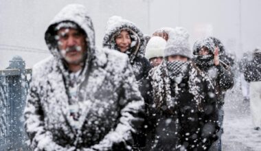 People are seen walking under heavy snowfall in the Eminonu area on Istanbul’s European side as snow continues to affect parts of the city during the first day of the New Year on Jan. 1, 2026. (AA Photo)
