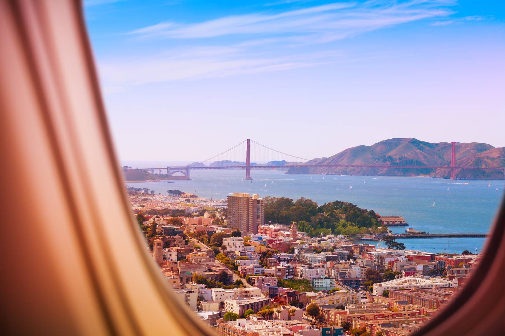 View of San Francisco Bay Area with the Golden Gate Bridge from a plane window