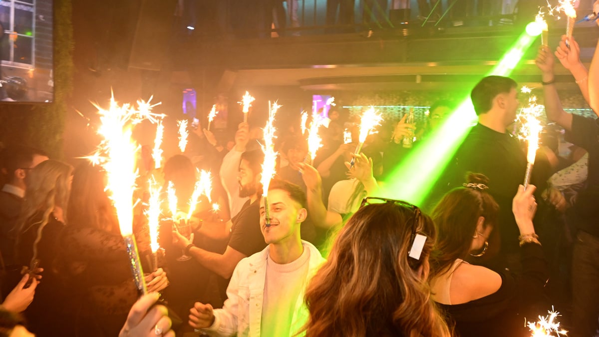 Partygoers celebrate in the Zulu Bar in Clausen.