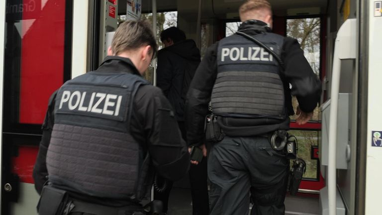 Police search a cross-border train