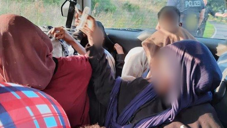 Migrants huddled together in a vehicle. Pic: Pasewalk Federal Police