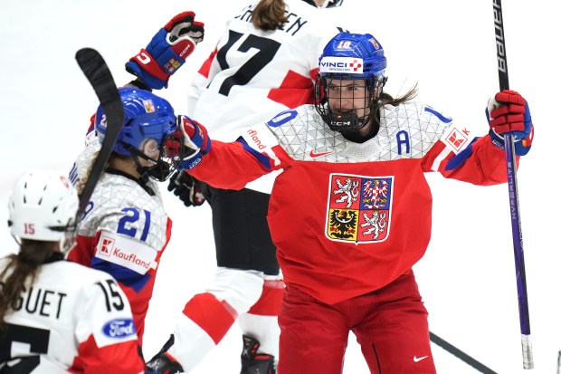 Tereza Vanisova of Czech Republic, left, celebrates with Denisa Krizova of Czech Republic after scoring her sides third goal during the quarterfinal match between Czech Republic and Switzerland at the Women's Ice Hockey Championships in Ceske Budejovice, Czech Republic, Thursday, April 17, 2025. (AP Photo/Petr David Josek)