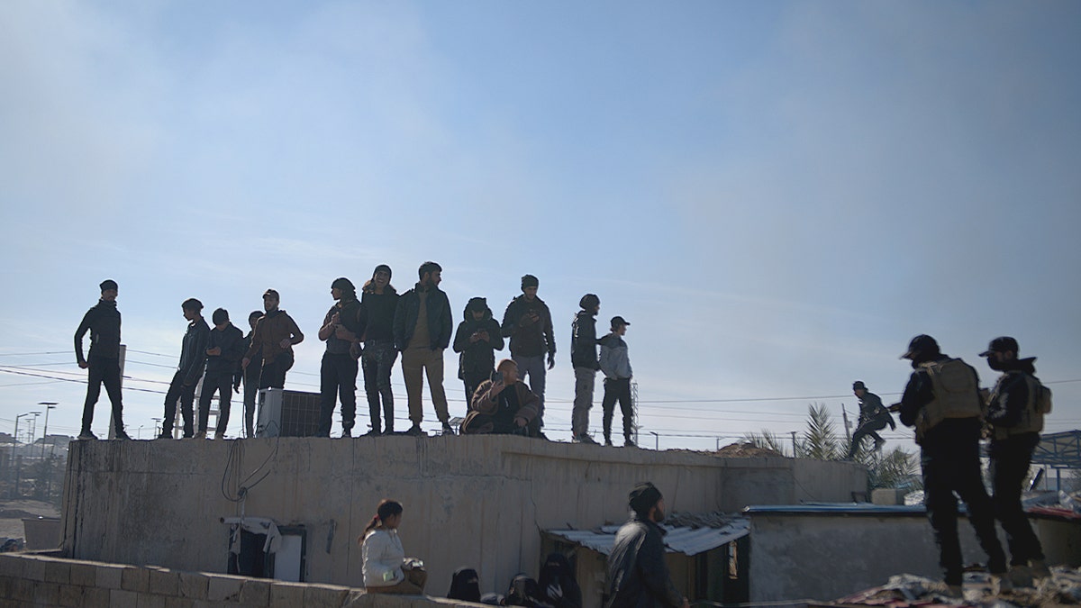 Syrian security forces at detention camp