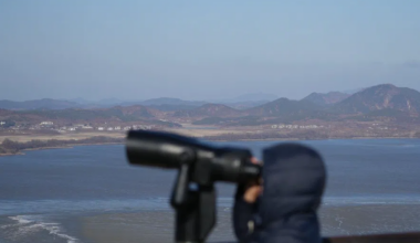 A visitor watches North Korean side from the unification observatory in Paju, South Korea, on Dec. 25, 2025.