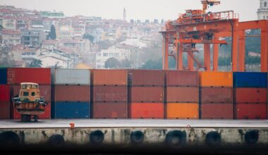 A view of stacked shipping containers and cranes at a freight terminal in Istanbul, Türkiye. (Adobe Stock Photo)