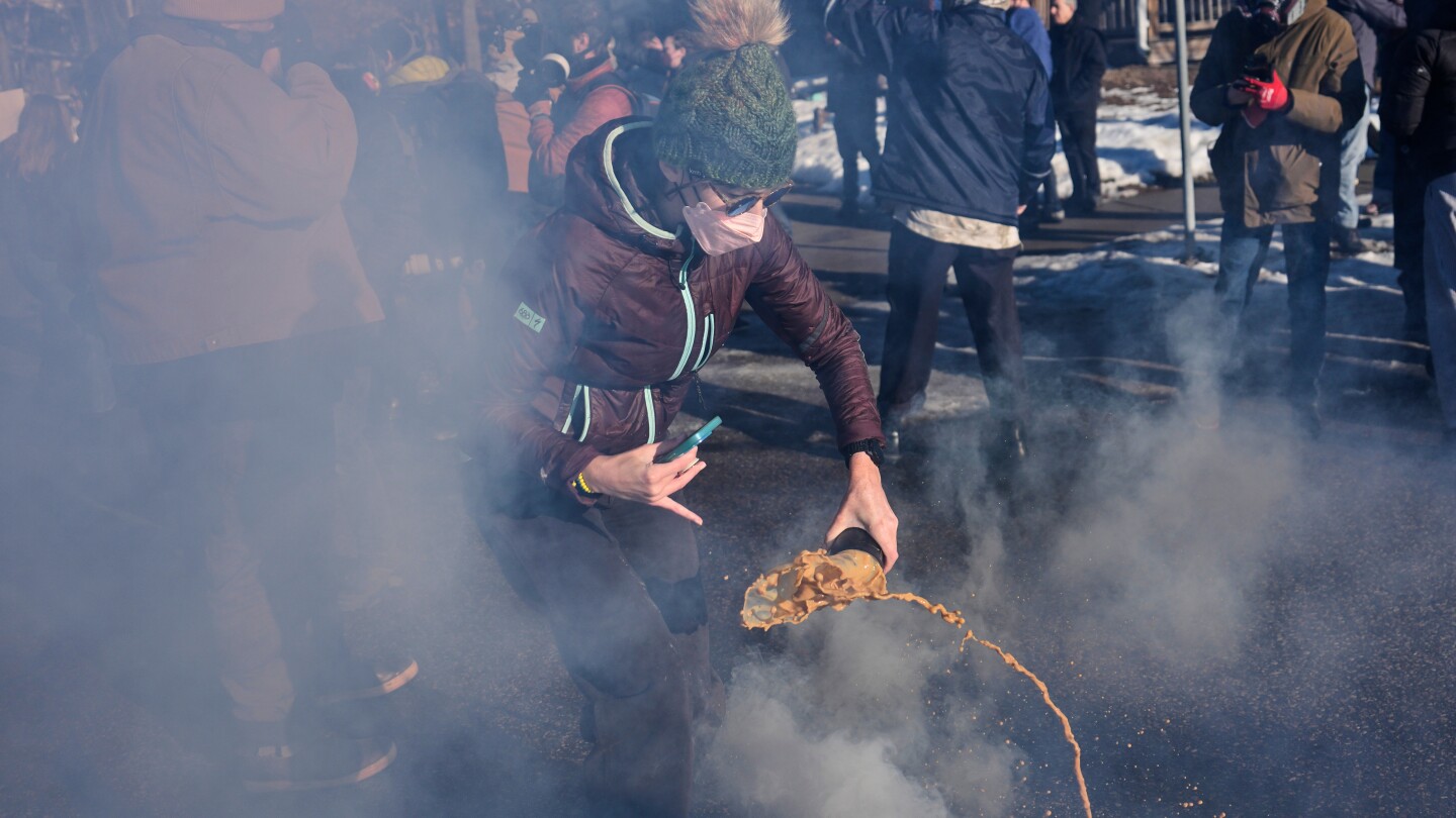 Tensions flare in Minnesota as federal agents and protesters square off