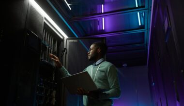 Engineer checking a computer in an AI data center.