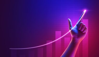 A hand pointing at a chart line going up.