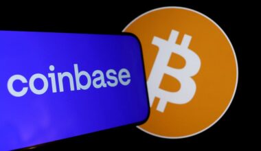 A phone displaying the Coinbase logo next to Bitcoin.