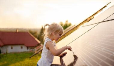 A child playing with a solar panel.
