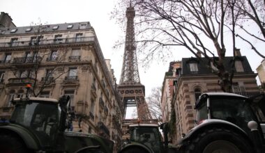 French farmers force their way through Paris with tractors to protest free trade deal