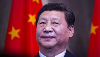 Xi Jinping in front of a Chinese flag.