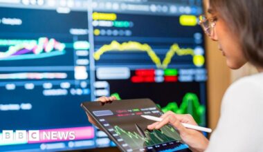 FTSE 100 hits 10,000 mark for first time.