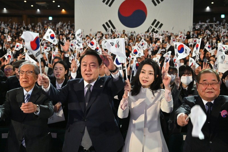 South Korean President Yoon Suk-yeol and his wife, Kim Keon-hee, give three cheers during the 104th Independence Movement Day ceremony in Seoul.