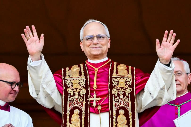 Newly elected Pope Leo XIV, Robert Prevost arrives on the main central loggia balcony of the St Peter's Basilica for the first time, after the cardinals ended the conclave, in The Vatican, on May 8, 2025. Robert Francis Prevost was on Thursday elected the first pope from the United States, the Vatican announced. A moderate who was close to Pope Francis and spent years as a missionary in Peru, he becomes the Catholic Church's 267th pontiff, taking the papal name Leo XIV.