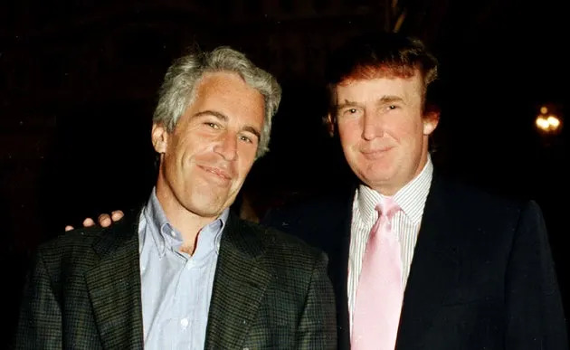 Jeffrey Epstein, left, and Donald Trump pose together at Trump's Mar-a-Lago estate in Palm Beach, Fla., in 1997.