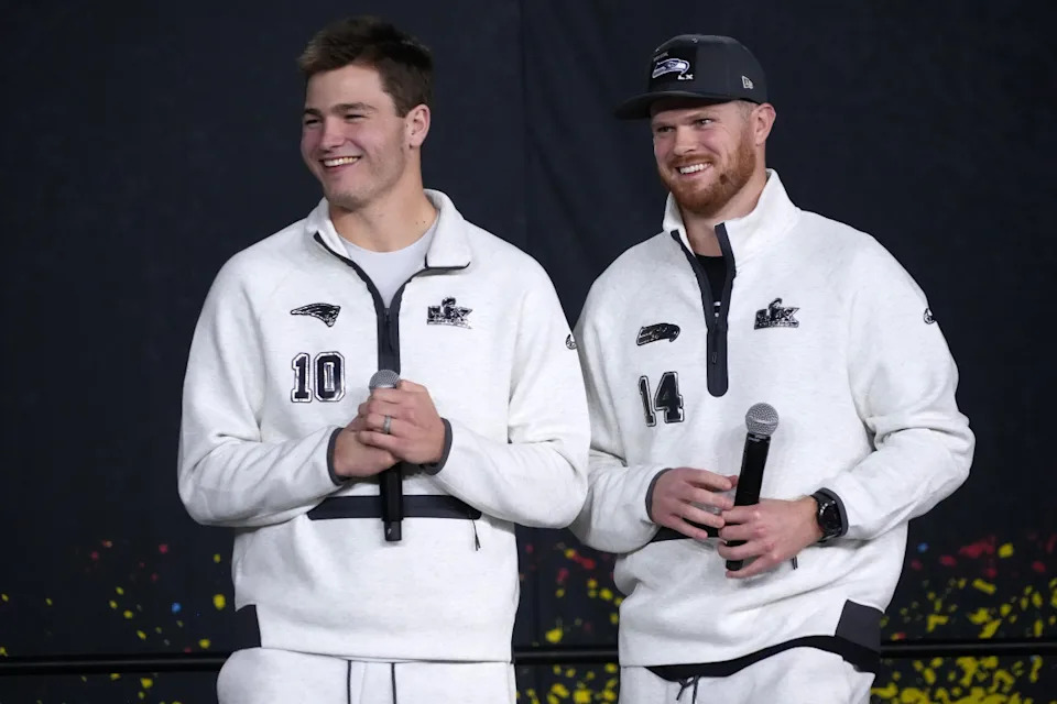 Feb 2, 2026; San Jose, CA, USA; Seattle Seahawks quarterback Sam Darnold (14) and New England Patriots quarterback Drake Maye (10) during Opening Night for Super Bowl LX at San Jose Convention Center. Mandatory Credit: Kirby Lee-Imagn Images© Kirby Lee-Imagn Images.