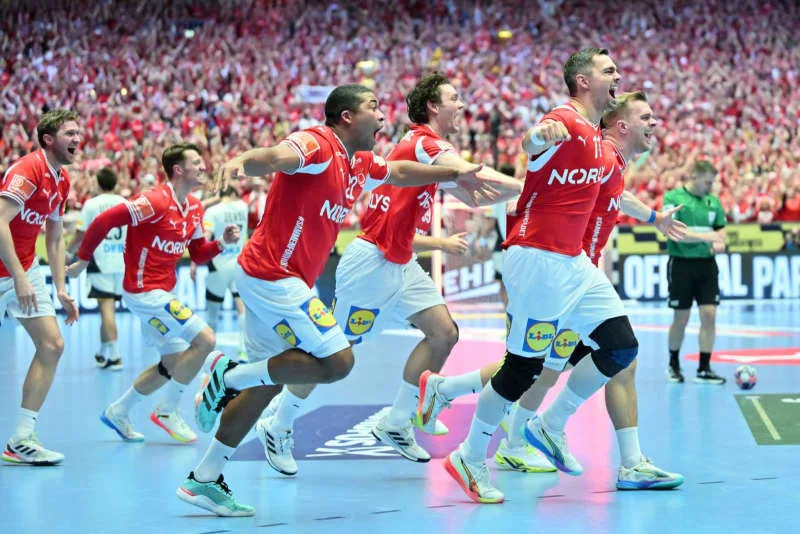 Denmark players celebrate after the European Men's Handball Championship final match between Germany and Denmark at the Jyske Bank Boxing. Sina Schuldt/dpa