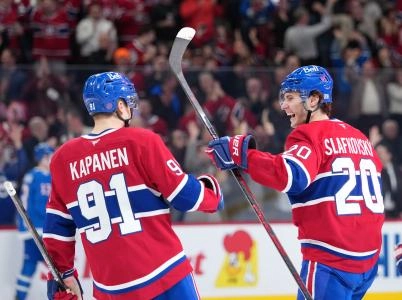 Jan 29, 2026; Montreal, Quebec, CAN; Montreal Canadiens forward Juraj Slafkovsky (20) celebrates with teammate forward Oliver Kapanen (91) after scoring a goal against the Colorado Avalanche during the third period at the Bell Centre.