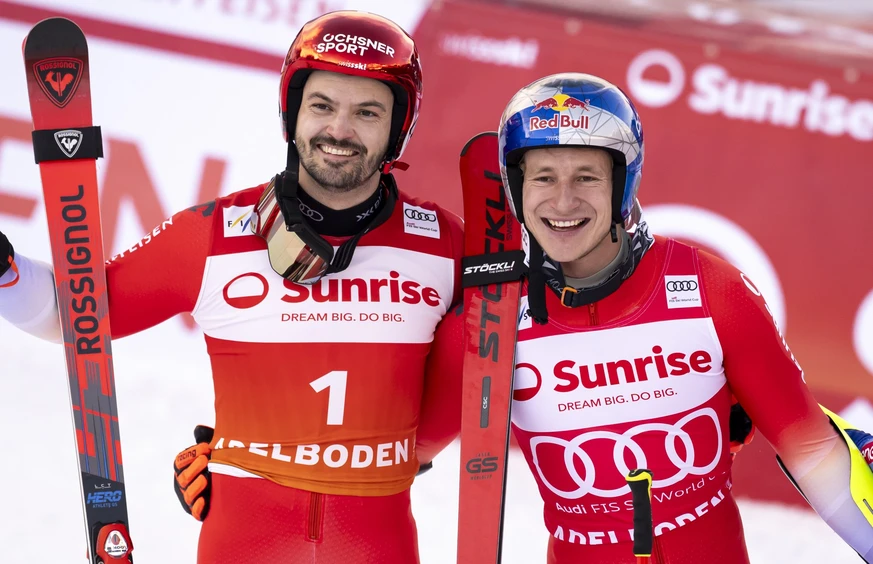 Second placed Loic Meillard of Switzerland, and winner Marco Odermatt of Switzerland pose after the second run of the men's Giant Slalom race at the Alpine Skiing FIS Ski World Cup, in Adelboden, ...