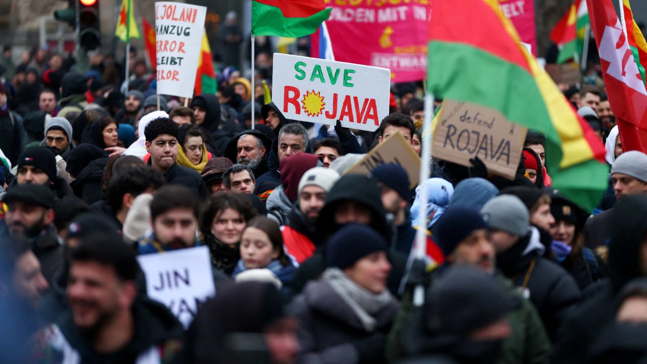 Members of the Kurdish community and other protesters attend a demonstration against recent military clashes between the Syrian army and Kurdish forces, in Berlin, Germany, January 24, 2026.
