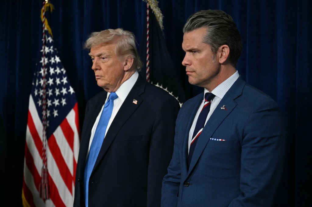 President Donald Trump and Defense Secretary Pete Hegseth at Trump’s Mar-a-Lago residence in Palm Beach, Florida, on January 3, 2026. (Photo by Jim WATSON/AFP/ Getty Images)