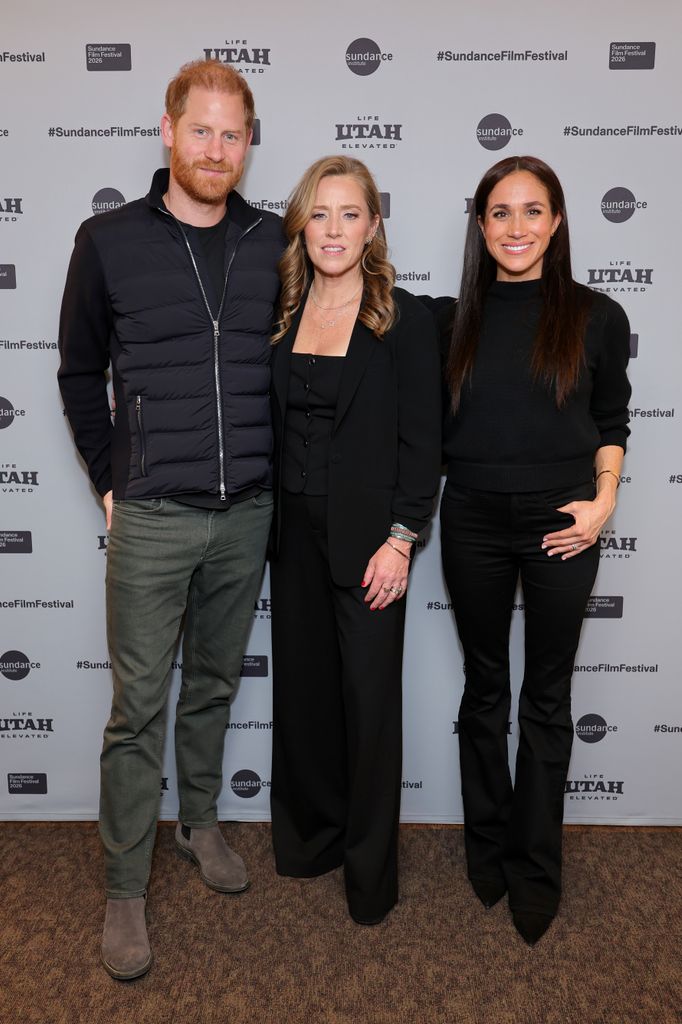 Prince Harry beside Amy Redford and Meghan markle in all black