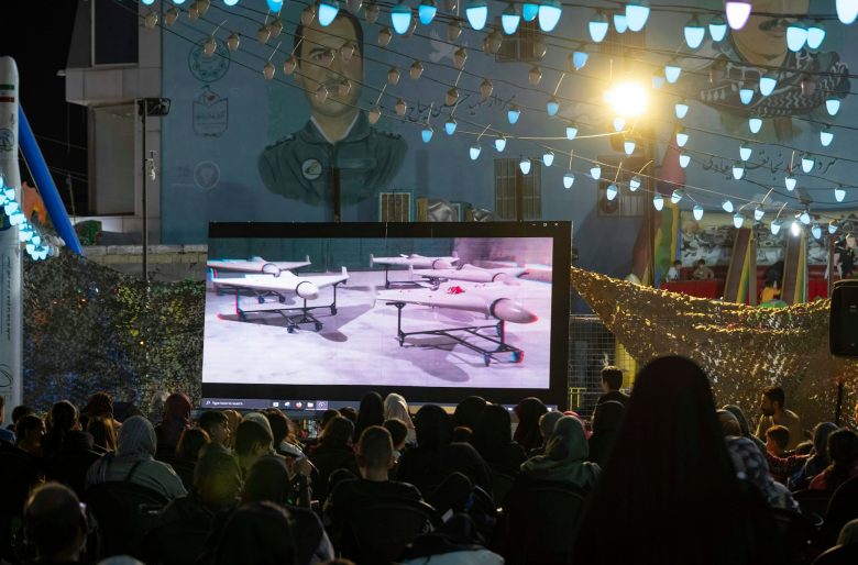 A screen shows flying vehicles.