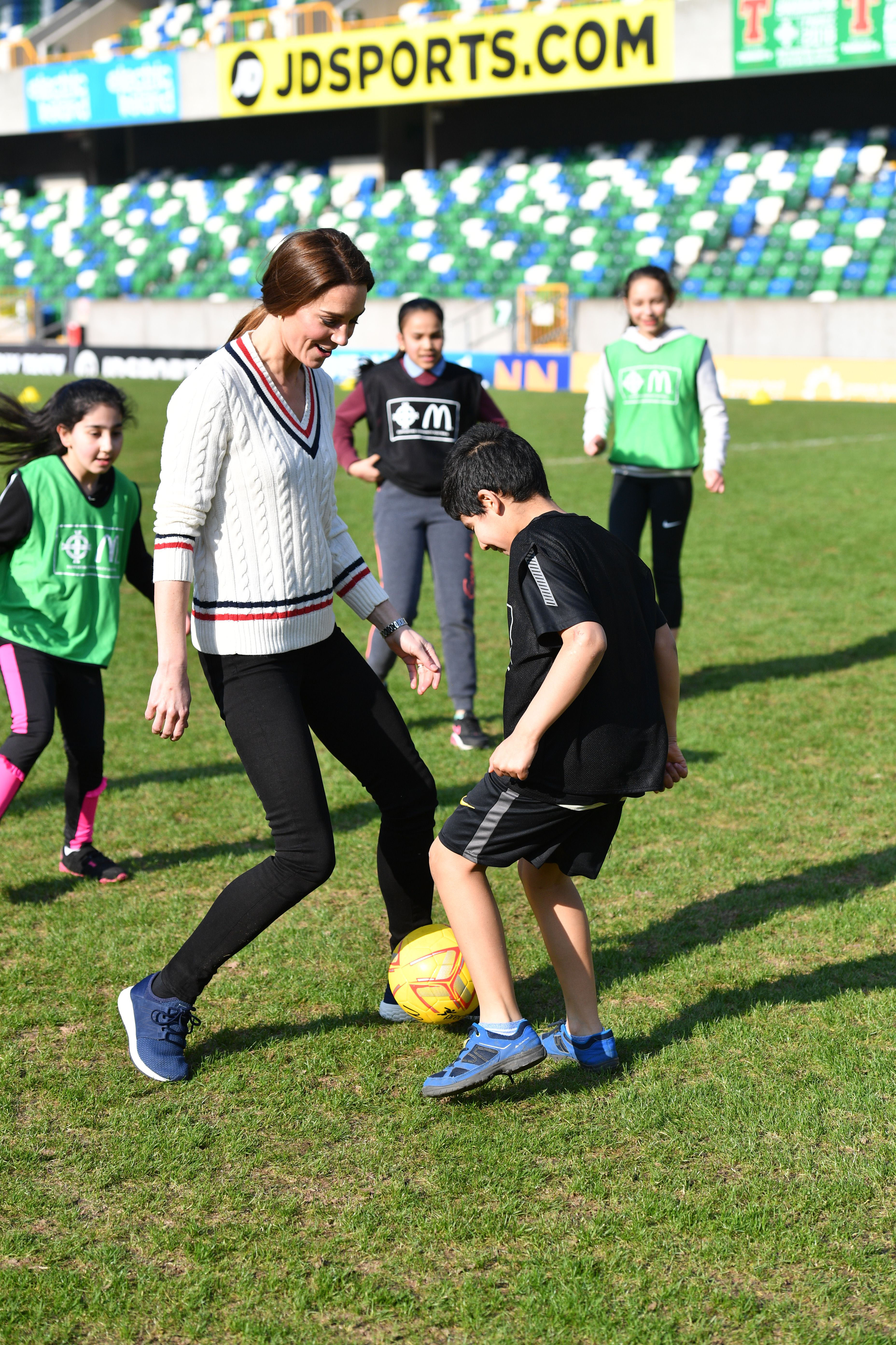 Princess Kate playing soccer with kids