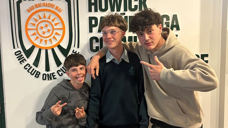 Max, centre, pictured holding his player of the year trophy.