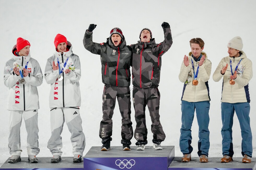 Austria wins gold in weather-shortened Olympic men's super team ski jump
