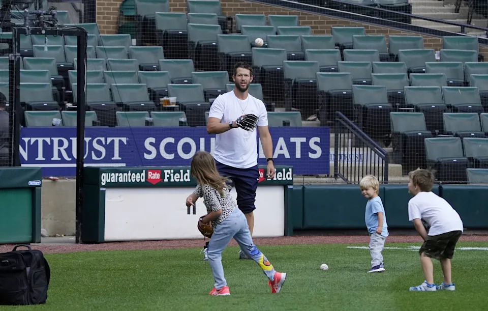 Jun 9, 2022; Chicago, Illinois, USA; Los Angeles Dodgers pitcher Clayton Kershaw plays with his children after the game against the Chicago White Sox at Guaranteed Rate Field. Mandatory Credit: David Banks-USA TODAY Sports