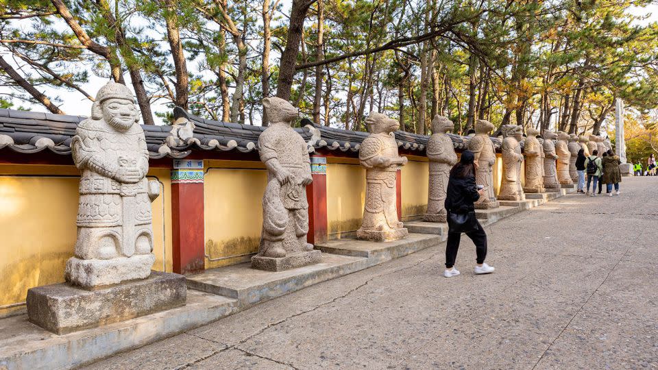 Stone sculptures represent the 12 animals of the Chinese zodiac. - Anne-Sophie Wittwer/imageBROKER//Shutterstock