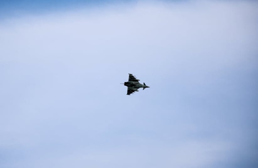 An aircraft flies near RAF Akrotiri, a British sovereign base that was hit by a drone early on Monday, causing limited damage, in Cyprus, March 6, 2026.