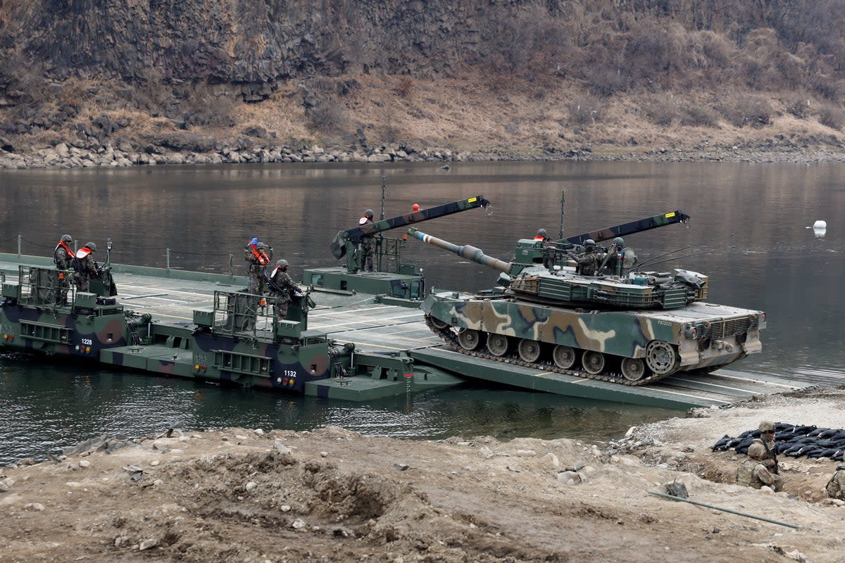 A South Korean army K1E1 tank crosses a pontoon bridge during a U.S.-South Korea joint river-crossing exercise, which is a part of the annual Freedom Shield joint military training, near the demilitarized zone separating South and North Korea, in Yeoncheon, South Korea (REUTERS)