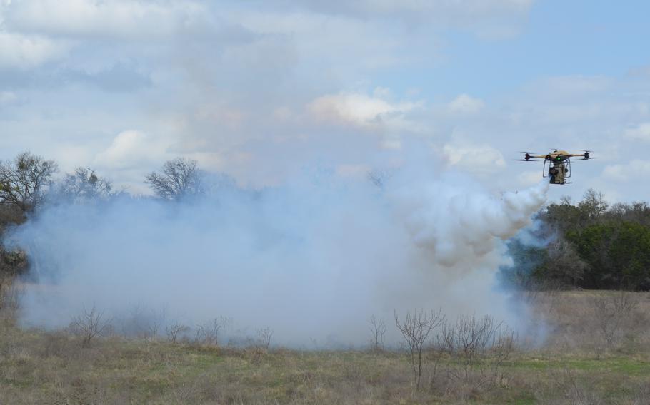 An airborne drone spews out a smokescreen.