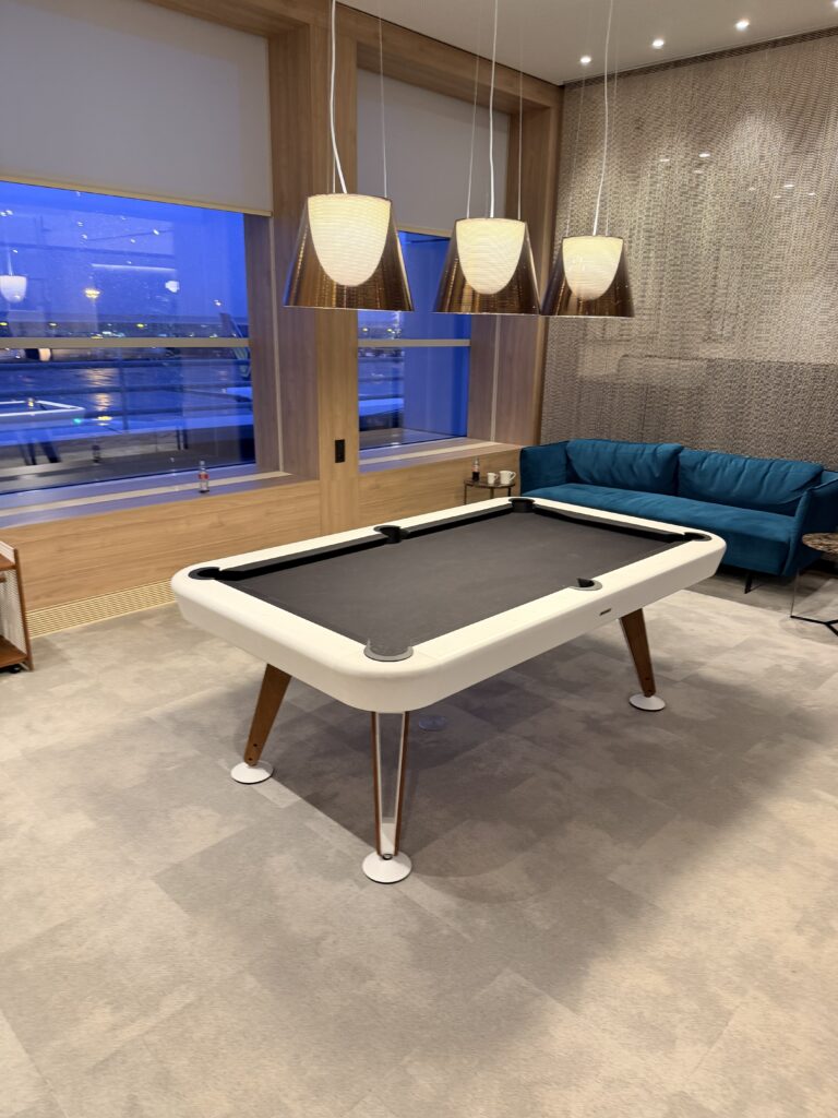 A pool table for passengers to use during their wait.