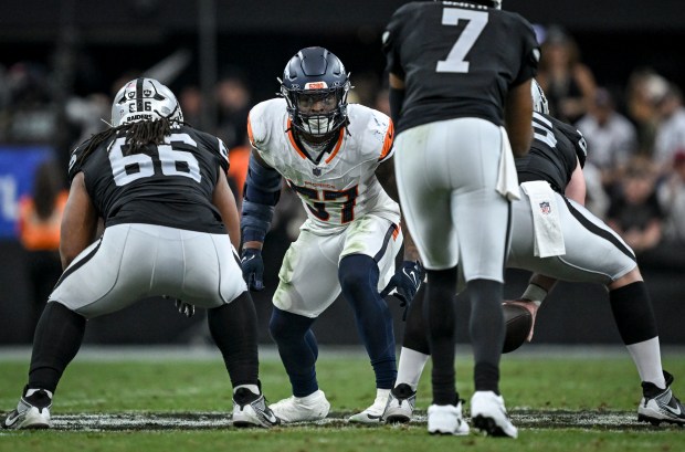 Dre Greenlaw (57) of the Denver Broncos lines up Geno Smith (7) of the Las Vegas Raiders during the second quarter at Allegiant Stadium in Las Vegas, Nevada on Sunday, Dec. 7, 2025. (Photo by AAron Ontiveroz/The Denver Post)