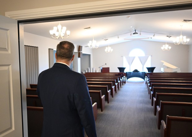 Mike Dudley, general manager of Rundus Funeral Home, walks into the funeral home's chapel in Broomfield on Jan. 19, 2026. (Photo by RJ Sangosti/The Denver Post)