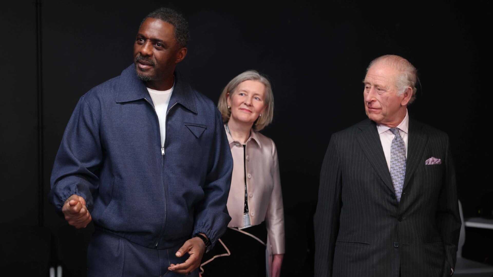 King Charles and Queen Camilla meet Idris Elba while touring college