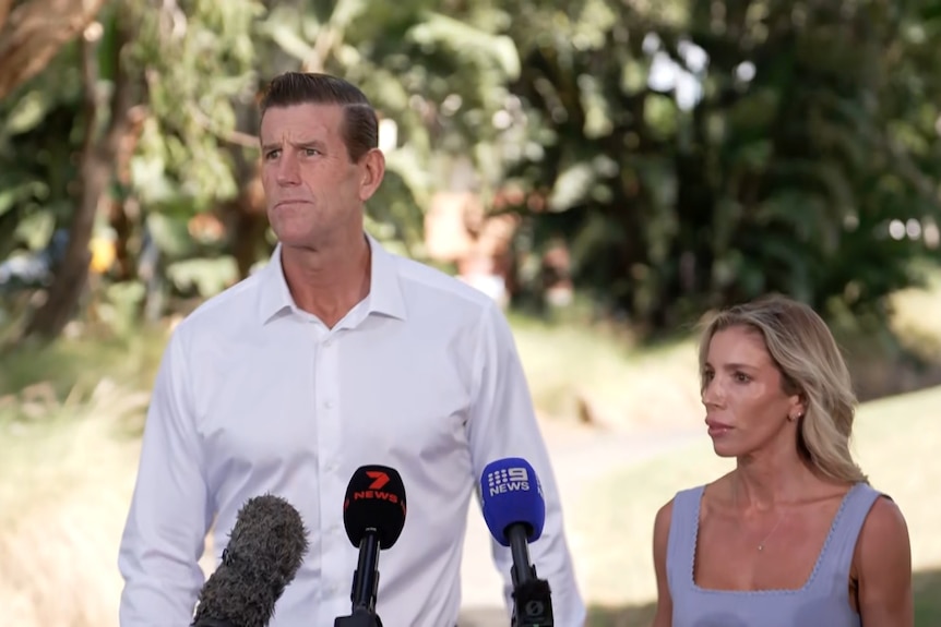ben roberts smith talks to the media with his partner sarah standing next to him