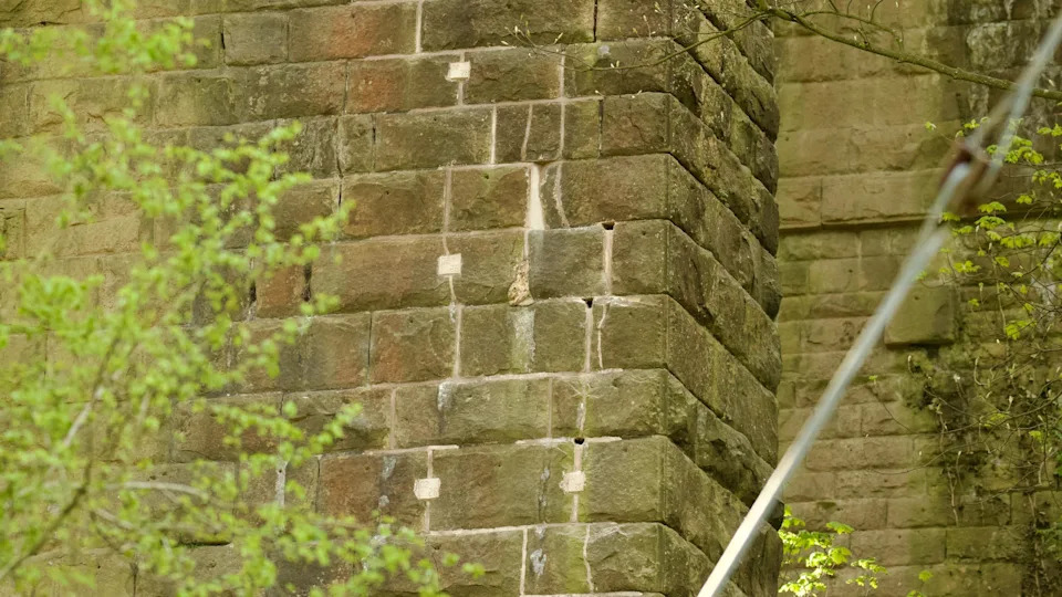 Holes in a stone wall