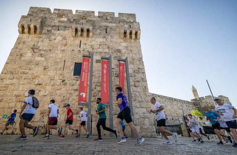 Thousands of runners take part in the annual Jerusalem marathon on April 4, 2025. (credit: YONATAN SINDEL/FLASH90)